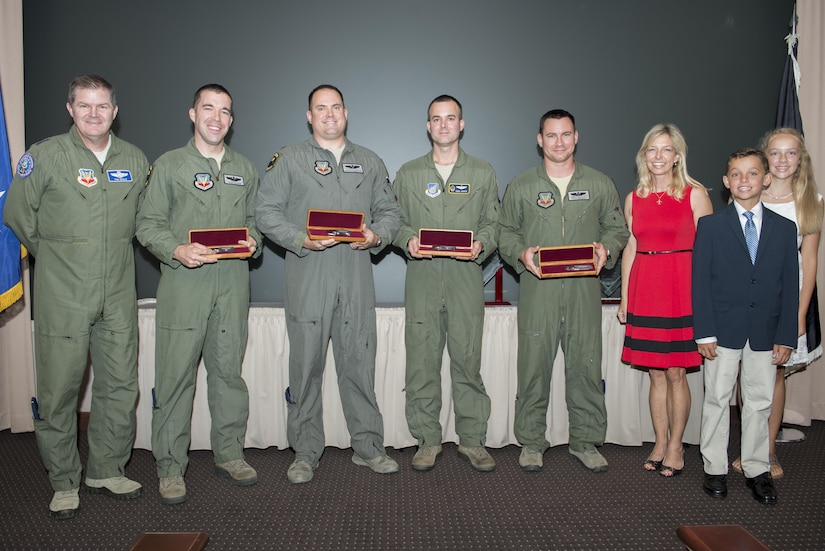 The 2011, 2012, 2014 and 2015 Lt. Col. Anthony C. Shine Fighter Pilot Award winners received engraved knives from Shine’s family during a ceremony at Langley Air Force Base, Va., Aug. 11, 2016. U.S. Air Force Maj. Gen. Thomas Deale, Air Combat Command Headquarters director of operations, presented the winners the awards with the Shine family. (U.S. Air Force photo by Staff Sgt. R. Alex Durbin)