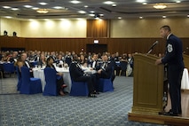 U.S. Air Force Chief Master Sgt. Edwin Ludwigsen, 52nd Fighter Wing command chief, speaks to senior NCOs and their families during a senior NCO induction ceremony at Club Eifel on Spangdahlem Air Base, Germany, Aug. 12, 2016. Ludwigsen served as guest speaker for the ceremony and addressed all newly promoted master sergeants and master sergeant-selects the responsibilities and privileges of being a senior NCO. (U.S. Air Force photo by Airman 1st Class Preston Cherry/Released)