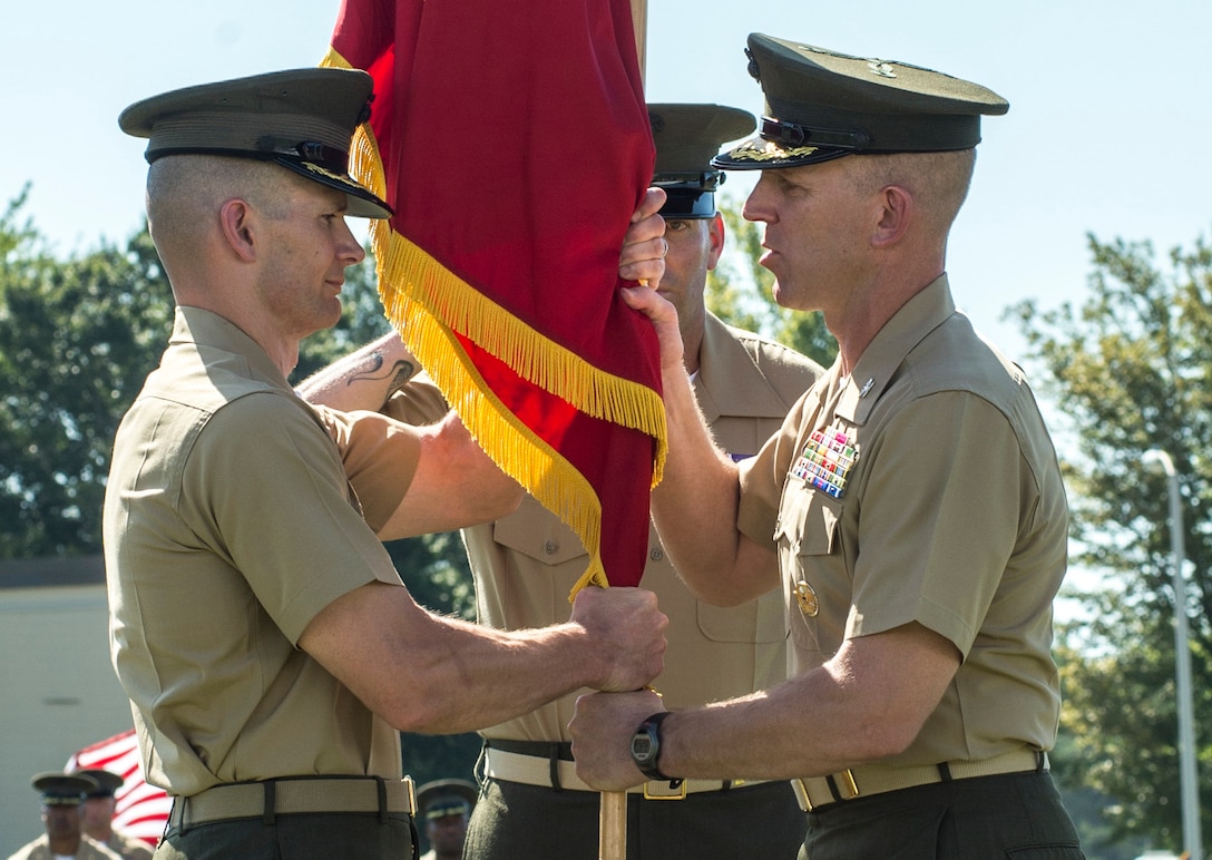 U.S. Marine Corps Col. Christian Wortman, commanding officer (CO), The Basic School (TBS), relinquishes command to U.S. Marine Corps Col. Mark Clingan at Camp Barrett, Quantico, Va., Aug. 12, 2016. The mission of TBS is to train and educate newly commissioned or appointed officers. (U.S. Marine Corps photo by Cpl. Alexander S. Norred/Released)