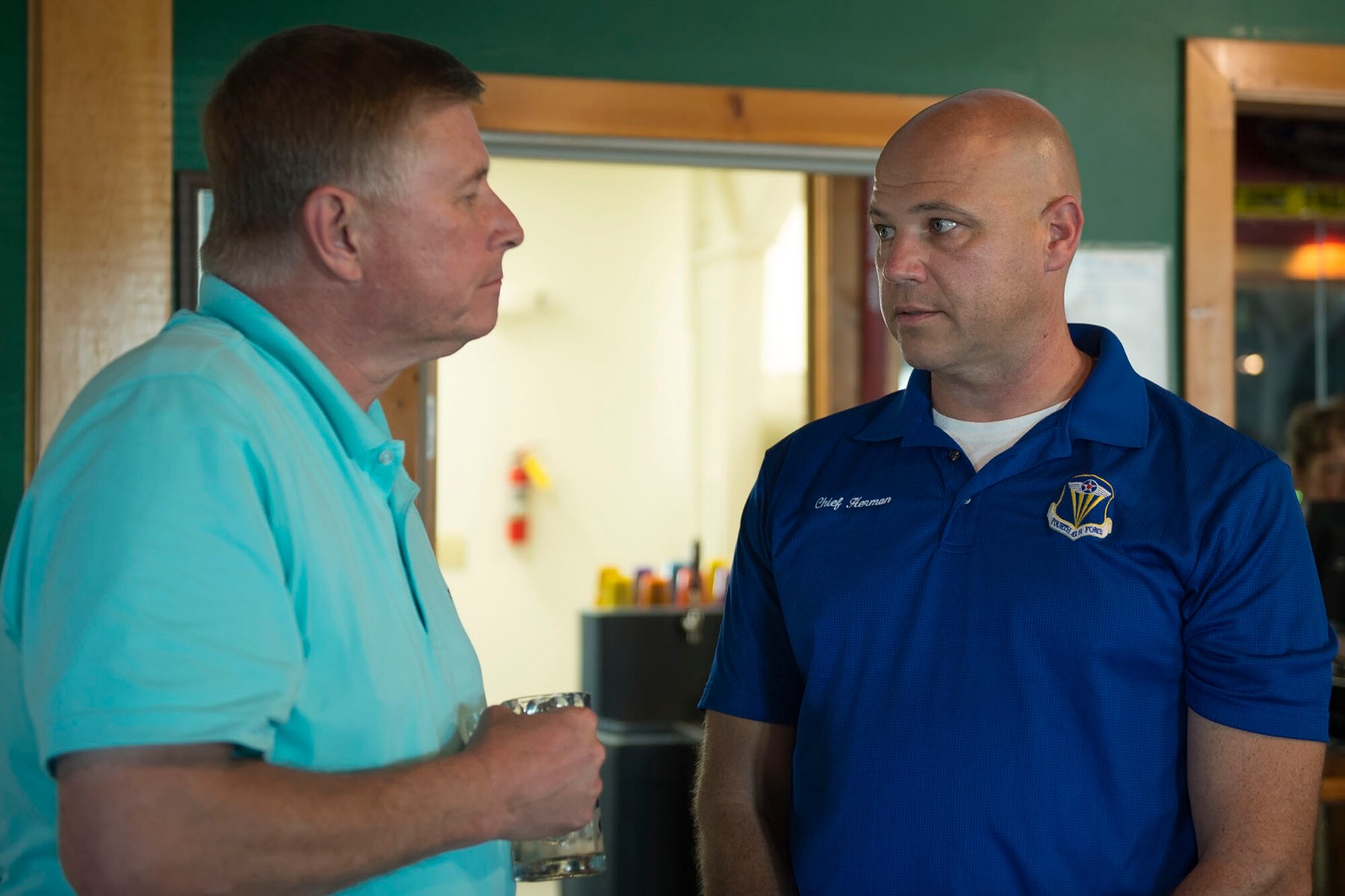 Retired Col. Doug Schwartz wishes Chief Master Sgt. Robert Herman, 434th Air Refueling Wing command chief, farewell during a going away ceremony here Aug. 6th, 2016. Herman will be moving to the nation’s Capital as the chief of senior enlisted management at the Pentagon. (U.S. Air Force photo/Staff Sgt. Jami K. Lancette)