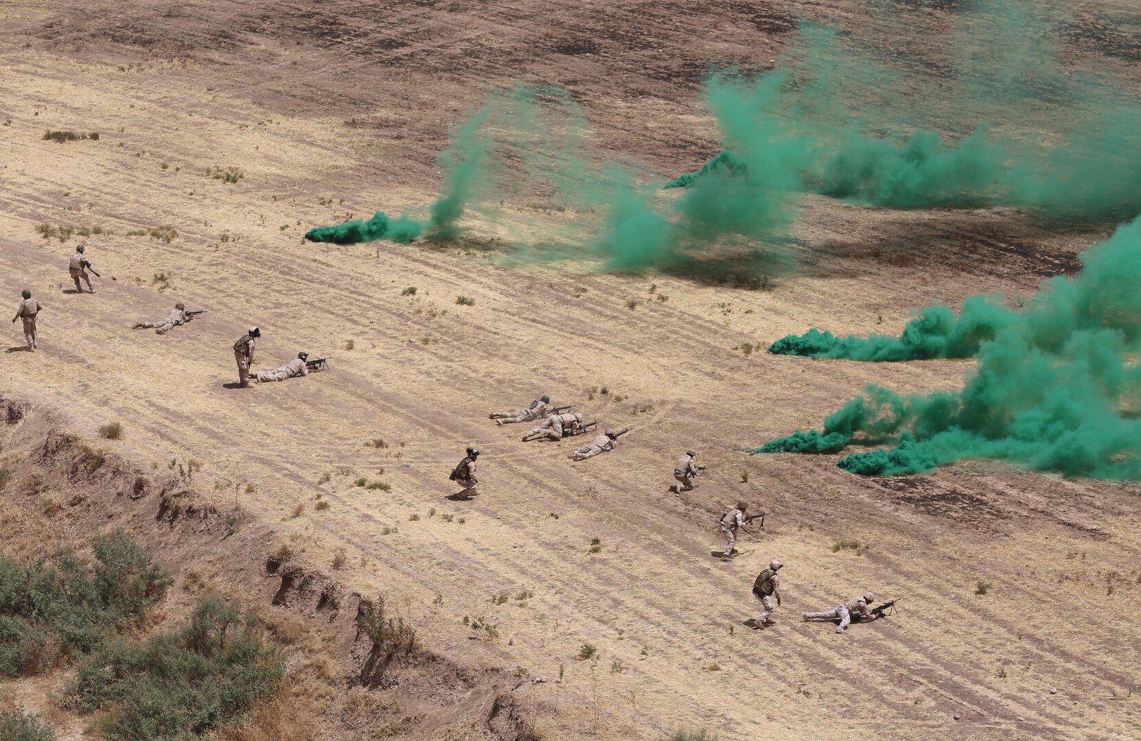 Italian trainers and Peshmerga soldiers advance on a target during the company assault portion of a combined arms training exercise near Erbil, Iraq, July 26, 2016. The combined arms exercise allowed trainers to review the Peshmerga soldiers’ understanding of all the training conducted over the past several weeks during the modern brigade course. Combined Joint Task Force – Operation Inherent Resolve aims to enable and equip indigenous forces to take the Islamic State of Iraq and the Levant head on while leveraging Coalition nation airpower to halt the terrorist’s momentum. 