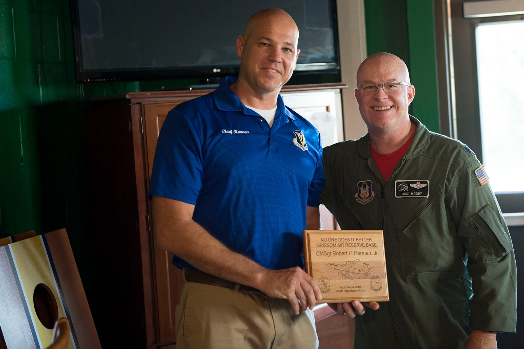 Lt. Col. Todd Moody, 434th Operations Group commander, presents a plaque to Chief Master Sgt. Robert Herman, 434th Air Refueling Wing command chief, during Herman’s going away ceremony here Aug. 6th, 2016. Herman will be moving to the nation’s Capital as the chief of senior enlisted management at the Pentagon. (U.S. Air Force photo/Staff Sgt. Jami K. Lancette)