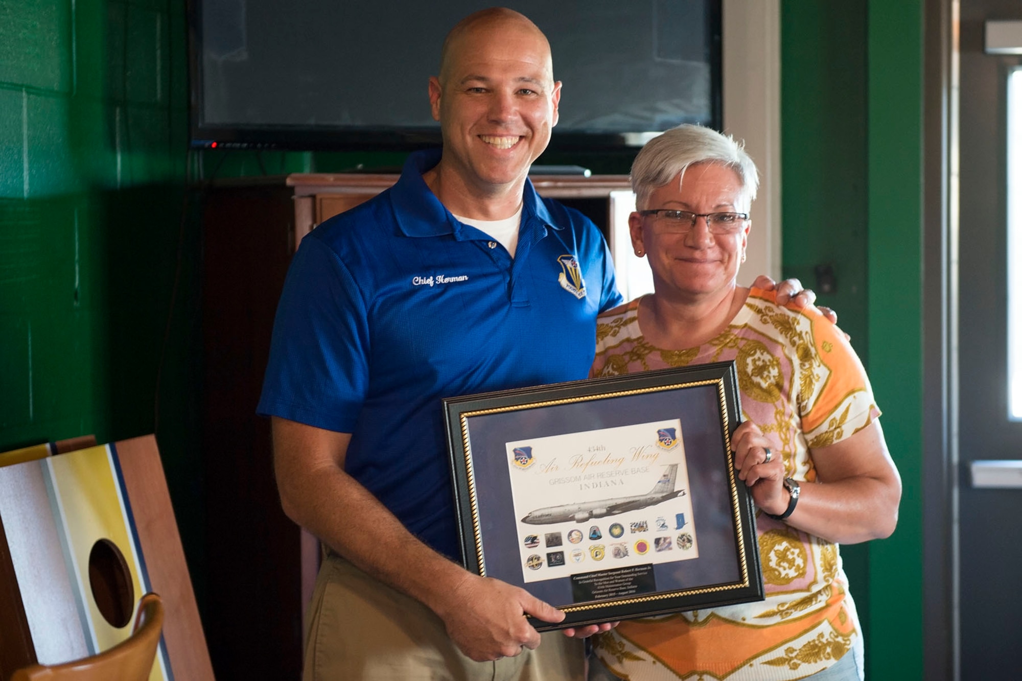 Col. Ann Schulte, 434th Maintenance Group commander, presents a plaque to Chief Master Sgt. Robert Herman, 434th Air Refueling Wing command chief, during Herman’s going away ceremony here Aug. 6th, 2016. Herman will be moving to the nation’s Capital as the chief of senior enlisted management at the Pentagon. (U.S. Air Force photo/Staff Sgt. Jami K. Lancette)