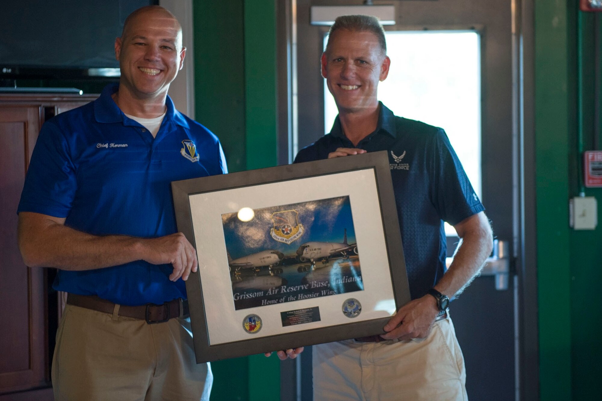Col. Larry Shaw, 434th Air Refueling Wing commander, presents a plaque to Chief Master Sgt. Robert Herman, 434th ARW command chief, during Herman’s going away ceremony here Aug. 6th, 2016. Herman will be moving to the nation’s Capital  as the chief of senior enlisted management at the Pentagon. (U.S. Air Force photo/Staff Sgt. Jami K. Lancette)