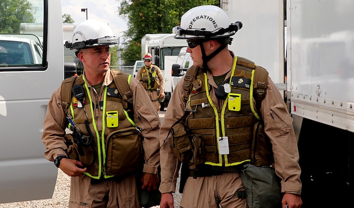 Sgt. Brian T. Brown, right, Initial Response Force, or IRF, operations chief, and Staff Sgt. Kevin W. Brown, left, staff noncommissioned officer in charge for IRF B, Chemical Biological Incident Response Force, CBIRF, discuss plans in preparation for the Republican National Convention, RNC, in Cleveland, July 18, 2016.
 CBIRF’s Marines and sailors worked alongside federal and local agencies to provide chemical, biological, radiological, nuclear and high-yield explosives, CBRNE, response capability for the Republican and Democratic National Conventions.
CBIRF is an active duty Marine Corps unit that, when directed, forward-deploys and/or responds with minimal warning to a chemical, biological, radiological, nuclear or high-yield explosive (CBRNE) threat or event in order to assist local, state, or federal agencies and the geographic combatant commanders in the conduct of CBRNE response or consequence management operations, providing capabilities for command and control; agent detection and identification; search, rescue, and decontamination; and emergency medical care for contaminated personnel.  (Official USMC Photo by Lance Cpl. Maverick S. Mejia/RELEASED)