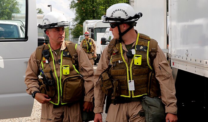 Sgt. Brian T. Brown, right, Initial Response Force, or IRF, operations chief, and Staff Sgt. Kevin W. Brown, left, staff noncommissioned officer in charge for IRF B, Chemical Biological Incident Response Force, CBIRF, discuss plans in preparation for the Republican National Convention, RNC, in Cleveland, July 18, 2016.
 CBIRF’s Marines and sailors worked alongside federal and local agencies to provide chemical, biological, radiological, nuclear and high-yield explosives, CBRNE, response capability for the Republican and Democratic National Conventions.
CBIRF is an active duty Marine Corps unit that, when directed, forward-deploys and/or responds with minimal warning to a chemical, biological, radiological, nuclear or high-yield explosive (CBRNE) threat or event in order to assist local, state, or federal agencies and the geographic combatant commanders in the conduct of CBRNE response or consequence management operations, providing capabilities for command and control; agent detection and identification; search, rescue, and decontamination; and emergency medical care for contaminated personnel.  (Official USMC Photo by Lance Cpl. Maverick S. Mejia/RELEASED)