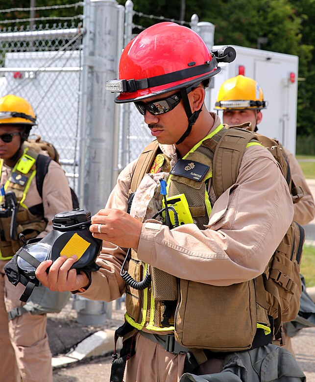 Sgt. Alfred Eldredge, a motor vehicle operator with Chemical Biological Incident Response Force, CBIRF, inspects his M53 gas mask for any damages in preparation for the Republican National Convention, RNC, in Cleveland, July 18, 2016.
CBIRF’s Marines and sailors worked alongside federal and local agencies to provide chemical, biological, radiological, nuclear and high-yield explosives, CBRNE, response capability for the Republican and Democratic National Conventions.
CBIRF is an active duty Marine Corps unit that, when directed, forward-deploys and/or responds with minimal warning t o a chemical, biological, radiological, nuclear or high-yield explosive (CBRNE) threat or event in order to assist local, state, or federal agencies and the geographic combatant commanders in the conduct of CBRNE response or consequence management operations, providing capabilities for command and control; agent detection and identification; search, rescue, and decontamination; and emergency medical care for contaminated personnel. (Official USMC Photo by Lance Cpl. Maverick S. Mejia/RELEASED)