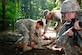 U.S. Army Pfc. Jennifer A. Aiken, 335th Transportation Company, pulls security while other Soldiers perform first aid at the combat lifesaver certification course hosted by the 7th Transportation Brigade (Expeditionary) at Fort Eustis, Va., Aug. 11, 2016.  Soldiers sought certification to gain the ability to respond and treat injuries while awaiting medic arrival. (U.S. Army photo by Spc. RomanRivera Wilmarys)