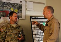 Col. Frederic A. Drummond, left, Army colonel with JTF-Shield, meets with Marine Lt. Col. Shaun T. Fitzpatrick, right, executive officer of Chemical Biological Incident Response Force, CBIRF, and mission commander for Initial Response Force B, with CBIRF, discuss plans in preparation for the Republican National Convention, RNC, in Cleveland, July 20, 2016.
 CBIRF’s Marines and sailors worked alongside federal and local agencies to provide chemical, biological, radiological, nuclear and high-yield explosives, CBRNE, response capability for the Republican and Democratic National Conventions.
CBIRF is an active duty Marine Corps unit that, when directed, forward-deploys and/or responds with minimal warning to a chemical, biological, radiological, nuclear or high-yield explosive (CBRNE) threat or event in order to assist local, state, or federal agencies and the geographic combatant commanders in the conduct of CBRNE response or consequence management operations, providing capabilities for command and control; agent detection and identification; search, rescue, and decontamination; and emergency medical care for contaminated personnel.  (Official USMC Photo by Lance Cpl. Maverick S. Mejia/RELEASED)