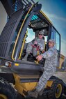 Col. Joseph McFall, 52nd Fighter Wing commander, is given instructions by Airman 1st Class Michael Panarello, 52nd Civil Engineer Squadron, on how to operate an excavator during an "out and about" visit at Spangdahlem Air Base, Germany, Aug. 11, 2016. The visit allowed Spangdahlem leadership to learn about the mission of the 52 CES heavy equipment operators, or "Dirt Boyz.” (U.S. Air Force photo by Tech. Sgt. Christopher Parr)