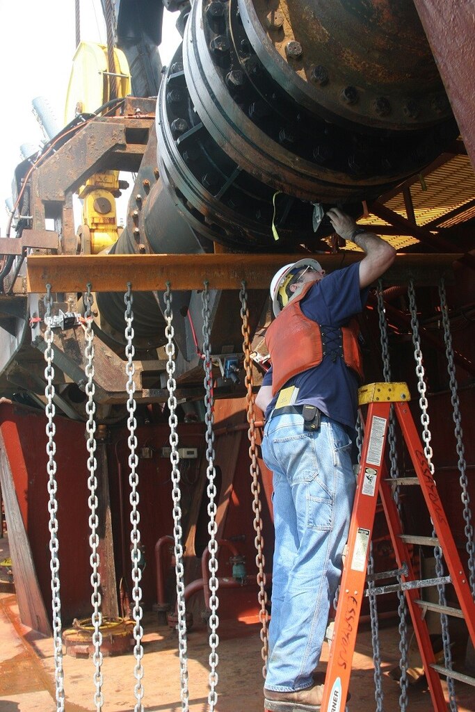 ERDC Research Hydraulic Engineer Tim Welp checks the movement of "tickler chains" designed to move sea turtles out of the way of dredging activities. The chains form a curtain extending off the dredging drag arm approximately 25 feet ahead of the draghead.

