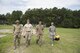 Airmen and a Soldier walk toward a controlled explosion site, Aug. 3, 2016 at Joint Base Charleston – Weapons Station, S.C. The joint post-blast analysis training exercise included 22 participants from the Kentucky Air National Guard, South Carolina Air National Guard, Army South Carolina Guard, MacDill Air Force Base, Fla. Seymour Johnson Air Force Base, N.C., 628th Civil Engineering Squadron and 315th CEF. The trainees honed their skills of collecting evidence after an IED attack. (U.S. Air Force photo/Staff Sgt. Jared Trimarchi)