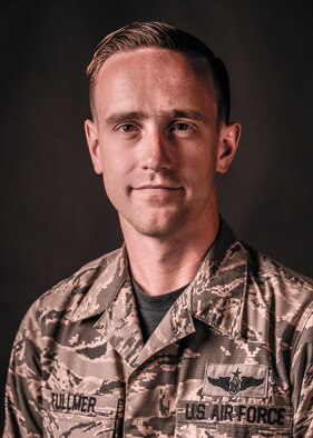 U.S. Air Force Staff Sgt. Eric Fullmer, 563rd Operations Support Squadron loadmaster, poses for a portrait at Davis-Monthan Air Force Base, Ariz., July 29, 2016. Fullmer and Senior Airman Shane Hardin assisted motorists injured in a pile up on Interstate 8, during a sandstorm. (U.S. Air Force photo illustration by Airman Nathan H. Barbour)