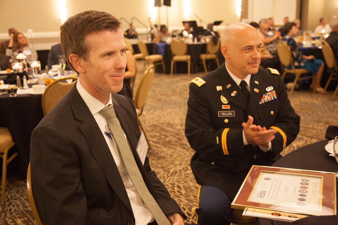 U.S. Army Reserve Capt. Spencer Teillon (Right), a Soldier assigned to 982nd Combat Camera Company (Airborne), 335th Signal Command (Theater), and also Architect of Computer Technology solutions (CTS) Incorporation, and Brendan Thomas (Left), President of CTS, were presented a Seven Seals Award for contributions their software company, CTS Inc., made to the Army Reserve and National guard at the Wyndham Peachtree Hotel and Conference Center in Peachtree City, Georgia, Aug. 12, 2016. ESGR seeks to promote a culture in all American employers support and value the military service of their employees. (U.S. Army Reserve photo by Pfc. Torrance Saunders/Released)