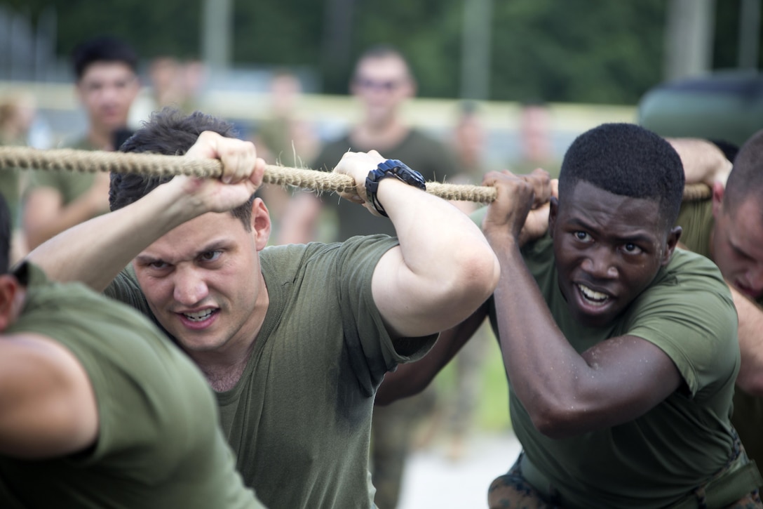 Marines participate in a 7-ton-pull during the 75th anniversary field meet competition at Marine Corps Air Station Cherry Point, N.C., Aug. 12, 2016. Headquarters and Headquarters Squadron, Marine Corps Air Station Cherry Point, and Marine Wing Headquarters Squadron 2, 2nd Marine Aircraft Wing, Marines of all ranks and ages came together to compete in numerous events testing their strength, teamwork and unit spirit. Some of the events the competitors participated in include: an all ranks relay, rifle relay race, unit soccer, a 7-ton pull and more. (U.S. Marine Corps photo by Cpl. N.W. Huertas/Released)