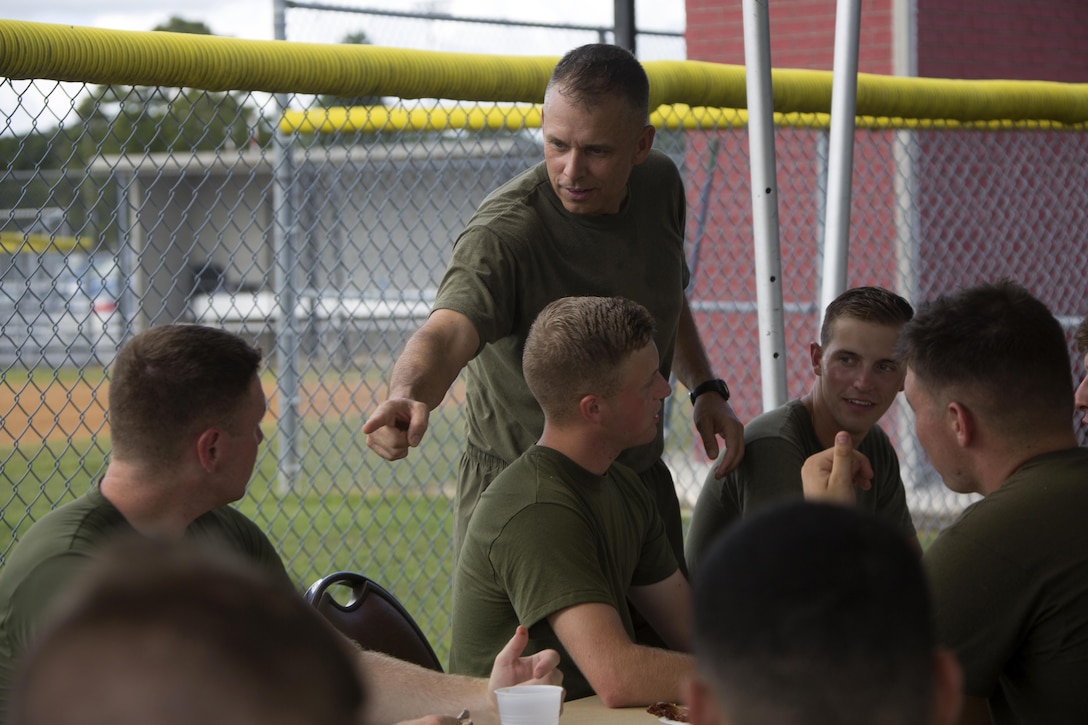 Brig. Gen Matthew G. Glavy interacts with Marines during the 75th anniversary field meet competition at Marine Corps Air Station Cherry Point, N.C., Aug. 12, 2016. Headquarters and Headquarters Squadron, Marine Corps Air Station Cherry Point, and Marine Wing Headquarters Squadron 2, 2nd Marine Aircraft Wing, Marines of all ranks and ages came together to compete in numerous events testing their strength, teamwork and unit spirit. Some of the events the competitors participated in include: an all ranks relay, rifle relay race, unit soccer, a 7-ton pull and more. Glavy is the commanding general for 2nd MAW. (U.S. Marine Corps photo by Cpl. N.W. Huertas/Released)