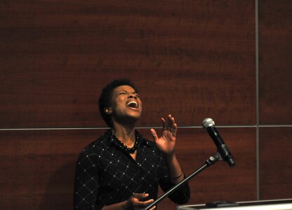 Lakeesha Blackshire performs an emotional version of the ‘Star Spangled Banner’ during a memorial ceremony for Capt. Joel Ico, Aug. 14, headquarters auditorium, Mountain View, Calif. Ico died July 4 at the age of 41, following an accident at his residence. He is survived by his wife Michelle and 7 children. (U.S. Army Reserve photo by Capt. Alun Thomas)