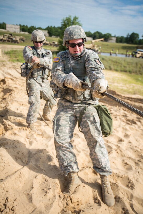 U.S. Army Spc. Michael Berrault (Front) and Spc. Adam Rankin, Bravo Company, 533 Maintenance Company, Devens, Mass., pull a tow wire for vehicle recovery during Combat Support Training Exercise (CSTX) 86-16-03 at Fort McCoy, Wis., August 9, 2016. The 84th Training Command’s third and final Combat Support Training Exercise of the year hosted by the 86th Training Division at Fort McCoy, Wis. is a multi-component and joint endeavor aligned with other reserve component exercises. (U.S. Army photo by Spc. John Russell/Released)