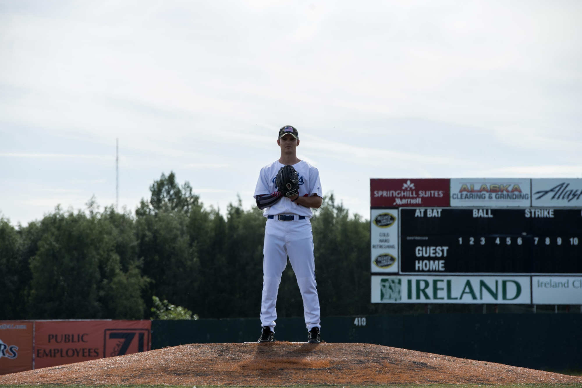 Gregory Eissens, an aircraft electrical and environmental systems Airman with the 732d Aircraft Mobility Squadron at Joint Base Elmendorf-Richardson, prepares a pitch at Mulcahy Baseball Stadium, at Anchorage, Alaska, Aug. 3, 2016. Eissens made his Alaska Baseball League pitching debut playing for the Anchorage Glacier Pilots in the 2016 season. (U.S. Air Force photo by Airman 1st Class Javier Alvarez)