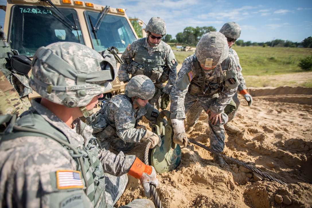 U.S. Army Soldiers from Bravo Company, 533 Maintenance Company, Devens, Mass., conduct vehicle recovery operations on a Light Medium Tactical Vehicle (LTV) during Combat Support Training Exercise (CSTX) 86-16-03 at Fort McCoy, Wis., August 9, 2016. The 84th Training Command’s third and final Combat Support Training Exercise of the year hosted by the 86th Training Division at Fort McCoy, Wis. is a multi-component and joint endeavor aligned with other reserve component exercises. (U.S. Army photo by Spc. John Russell/Released)
