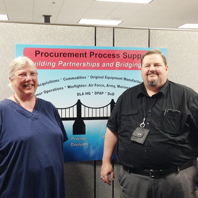 Defense Logistics Agency Aviation Procurement Analysts Beth Lamothe and Richard Bullock pose for a photo Aug. 9, 2016 on Defense Supply Center Richmond, Virginia.  Lamothe and Bullock serve as DLA Aviation’s font line in fraud monitoring. 