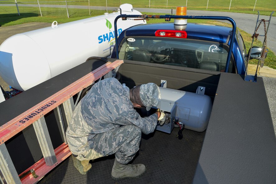 Airman 1st Class Daniel Ortiz, 436th Civil Engineer Squadron heating, ventilation and air conditioning, fills a 24-gallon propane tank Aug. 12, 2016, at Dover Air Force Base, Del. Dover is one of two bases to participate in the Office of the Secretary of Defense Propane Initiative. (U.S. Air Force photo by Senior Airman William Johnson)