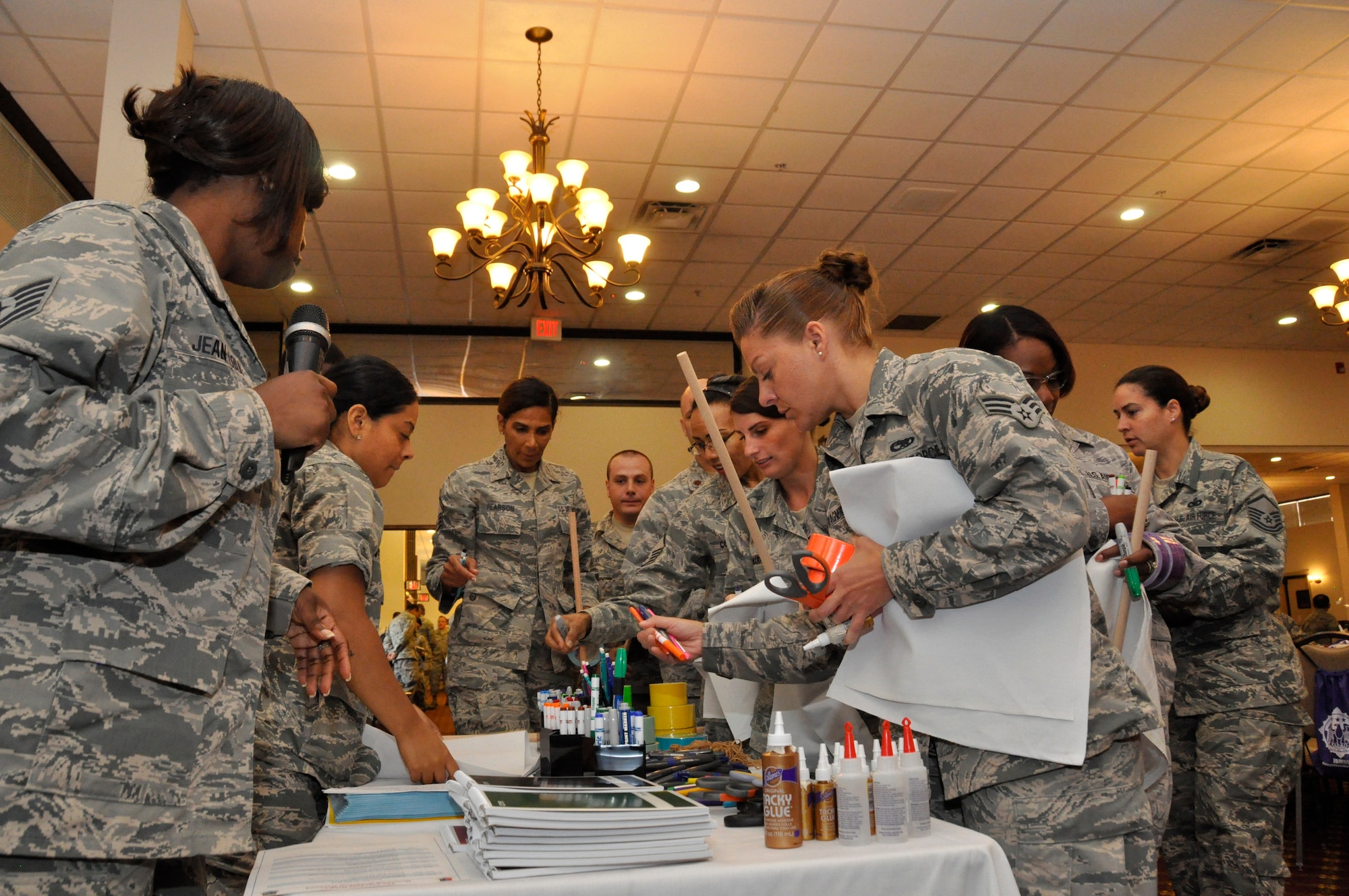Participants in the Freedom Wing's annual mentoring workshop gather supplies to work on their team identity project. Seventy-six Airmen took part in the workshop hosted by the 514th Air Mobility Wing Human Resources Development Council here July 30-31. (U.S. Air Force photo/Tech. Sgt. Jonathan White)