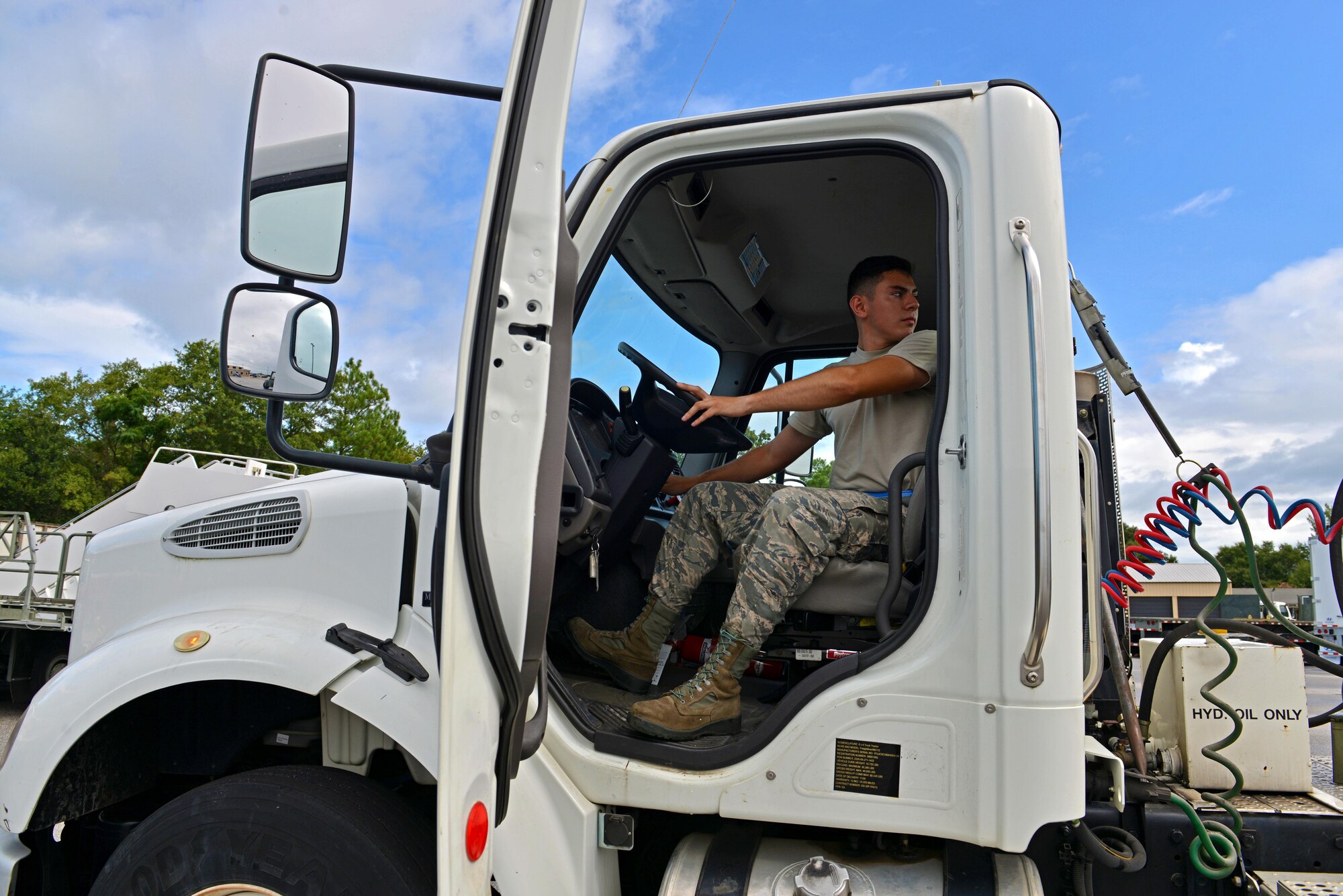 U.S. Air Force Airman Alejandro Ponce, 20th Logistics Readiness Squadron vehicle operations dispatcher, inspects the mechanical functions of a tractor trailer at Shaw Air Force Base, S.C., Aug. 10, 2016. On average, vehicle operations personnel require 30-40 hours of training on each vehicle type before an Airman is qualified to drive each vehicle. (U.S. Air Force photo by Airman 1st Class Destinee Sweeney)