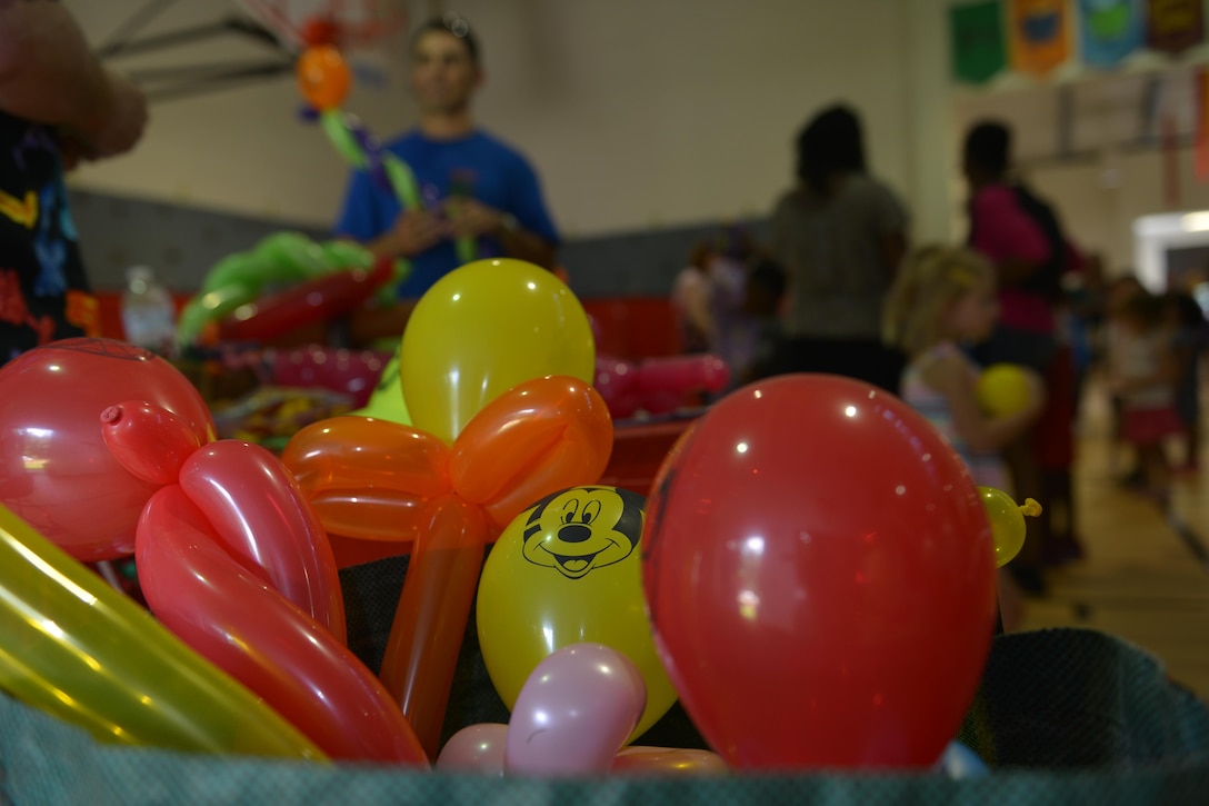 Balloons made by JT Stark, balloon artist, sit in a bin for people to pick from at the Fort Eustis Community Block Party at Fort Eustis, Va., Aug. 12, 2016. School aged children and their families enjoyed balloons ranging from animals to swords. (U.S. Air Force photo by Staff Sgt. Natasha Stannard)
