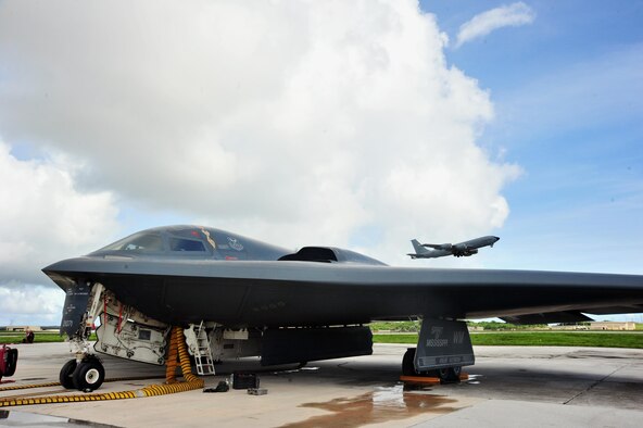 A U.S. Air Force B -2 Spirit aircraft deployed from Whiteman Air Force Base, Mo., undergoes flight preparations as a KC-135 Stratotanker takes flight at Andersen Air Force Base, Guam, Aug. 15, 2016. The U.S. routinely and visibly demonstrates its commitment to its allies and partners through the global operations of our military forces. (U.S. Air Force photo by Senior Airman Jovan Banks)