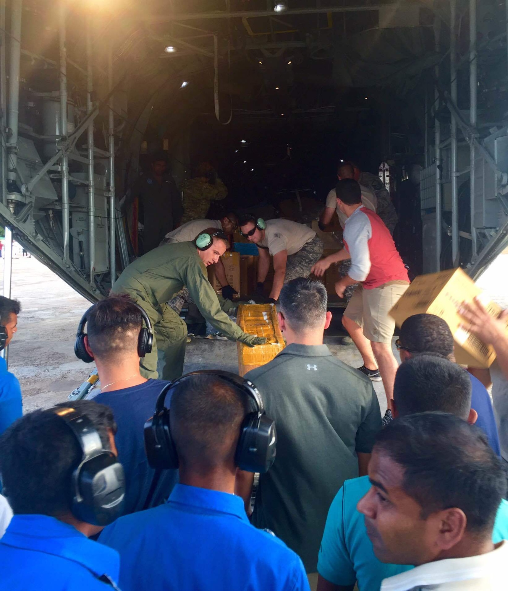 U.S. Military members and the Sri Lankan Air Force work together to unload medical supplies from a U.S. Air Force C-130 aircraft during Pacific Angel (PACANGEL) 16-3 in Jaffna, Sri Lanka, Aug. 13, 2016. PACANGEL is a multilateral humanitarian assistance/civil military operation, which improves military-to-military partnerships in the Pacific while also providing medical health outreach, civic engineering projects and subject matter exchanges among partner forces. (U.S. Air Force photo by 1st Lt. Samantha Morrison)