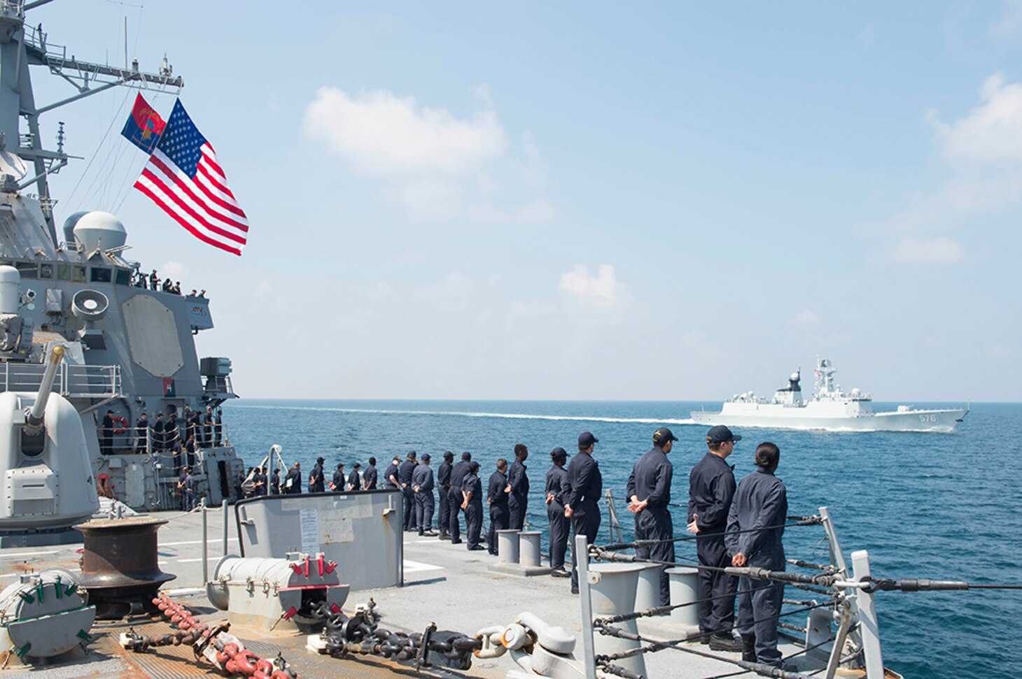 Sailors aboard the Arleigh Burke-class guided-missile destroyer USS Benfold (DDG 65) man the rails before the ship breaks away from the People's Liberation Army (Navy) Jiangkai II class frigate Daqing (FFG 576) during a Code for Unplanned Encounters at Sea exercise, Aug. 12, 2016. Benfold is currently underway in the the Western Pacific  in support of security and stability in the Indo-Asia Pacific region. 
