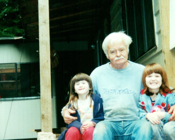 George G. Shaw, center, poses for a photo with his granddaughters Jenna K. Caldwell left and Megan E. Caldwell on the back porch steps of their house, 2001, in Arcata, Calif. (Courtesy photo)