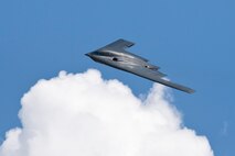 A B-2 Spirit flies above the clouds during the Northern Neighbors Day Air Show at Minot Air Force Base, N.D., Aug. 13, 2016. The B-2 Spirit flew over 10,000 attendees during NND. (U.S. Air Force photo/Airman 1st Class J.T. Armstrong)