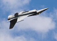 An F-16 Fighting Falcon soars inverted above the crowd during the Northern Neighbors Day Air Show at Minot Air Force Base, N.D., Aug. 13, 2016. The Viper Demo Team performed for more than 10,000 spectators during NND. (U.S. Air Force photo/Airman 1st Class J.T. Armstrong)