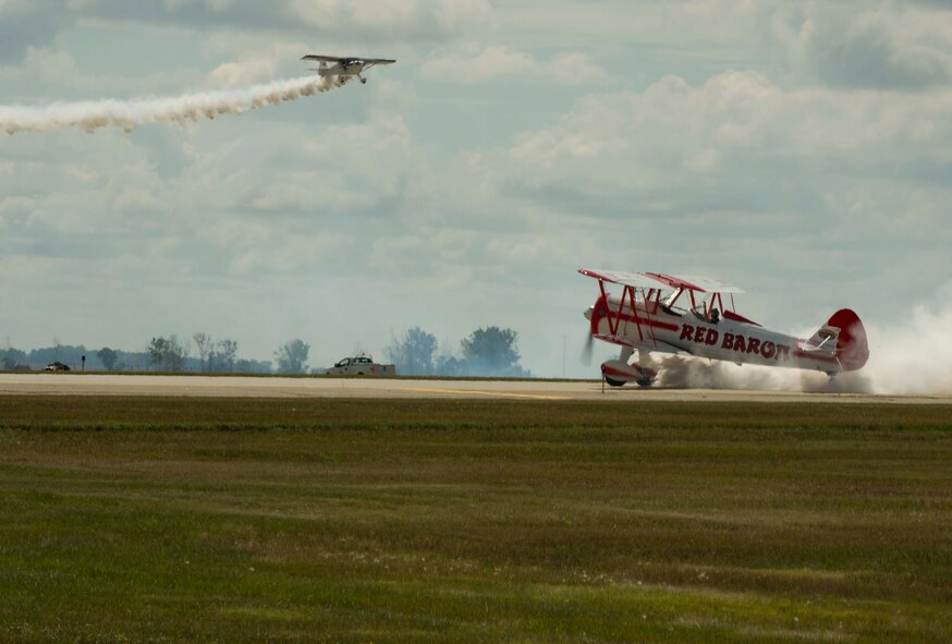 Aircraft perform during Northern Neighbors Day at Minot Air Force Base, N.D., Aug. 13, 2016. The air show featured civilian and military performances. (U.S. Air Force photo/Senior Airman Apryl Hall)