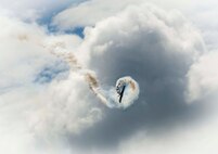 An aircraft barrels through the sky during the Northern Neighbors Day Air Show at Minot Air Force Base, N.D., Aug. 13, 2016. The air show featured demonstrations from civilian and military aircraft. (U.S. Air Force photo/Senior Airman Sahara L. Fales)