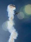 An aircraft barrels through the sky during the Northern Neighbors Day Air Show at Minot Air Force Base, N.D., Aug. 13, 2016. The air show featured demonstrations from civilian and military aircraft. (U.S. Air Force photo/Senior Airman Sahara L. Fales)