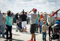 Crowd members take pictures of the F-16 Fighting Falcon and P-51D Mustang Heritage Flight during the Northern Neighbors Day Air Show at Minot Air Force Base, N.D., Aug. 13, 2016. The two aircraft flew together to showcase how our aircraft has evolved. (U.S. Air Force photo/Senior Airman Sahara L. Fales)