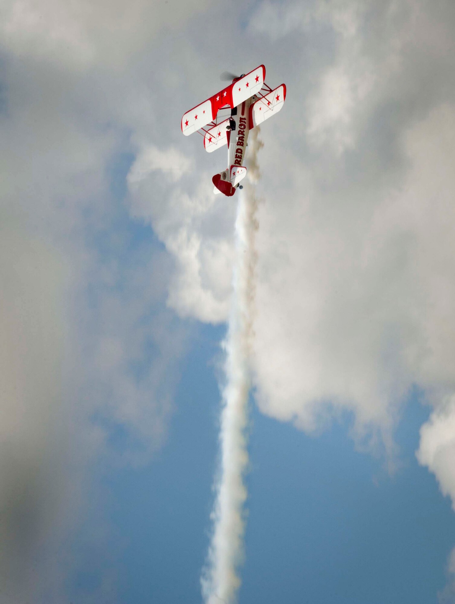 An aircraft named the “Red Baron” performs during the Northern Neighbors Day Air Show at Minot Air Force Base, N.D., Aug. 13, 2016. The pilot demonstrated aerial acrobatics during the air show. (U.S. Air Force photo/Senior Airman Sahara L. Fales)