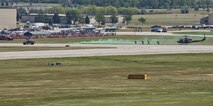 Tactical Response Force members approach a Humvee while performing a demonstration during the Northern Neighbors Day Air Show at Minot Air Force Base, N.D., Aug. 13, 2016. As part of a UH-1N insertion, TRF members demonstrated how they would provide air support to ground forces. (U.S. Air Force photo/Airman 1st Class J.T. Armstrong)