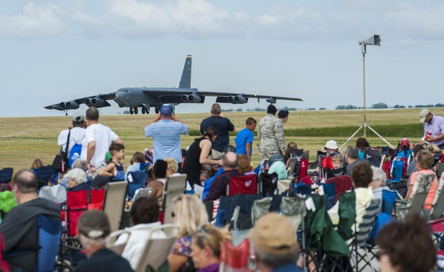 Spectators watch as a B-52H Stratofortress prepares to take off during the Northern Neighbors Day Air Show at Minot Air Force Base, N.D., Aug. 13, 2016. The B-52 kicked off the show after taking off and circled around during the air show and finished the show with a landing. (U.S. Air Force photo/Airman 1st Class Christian Sullivan)