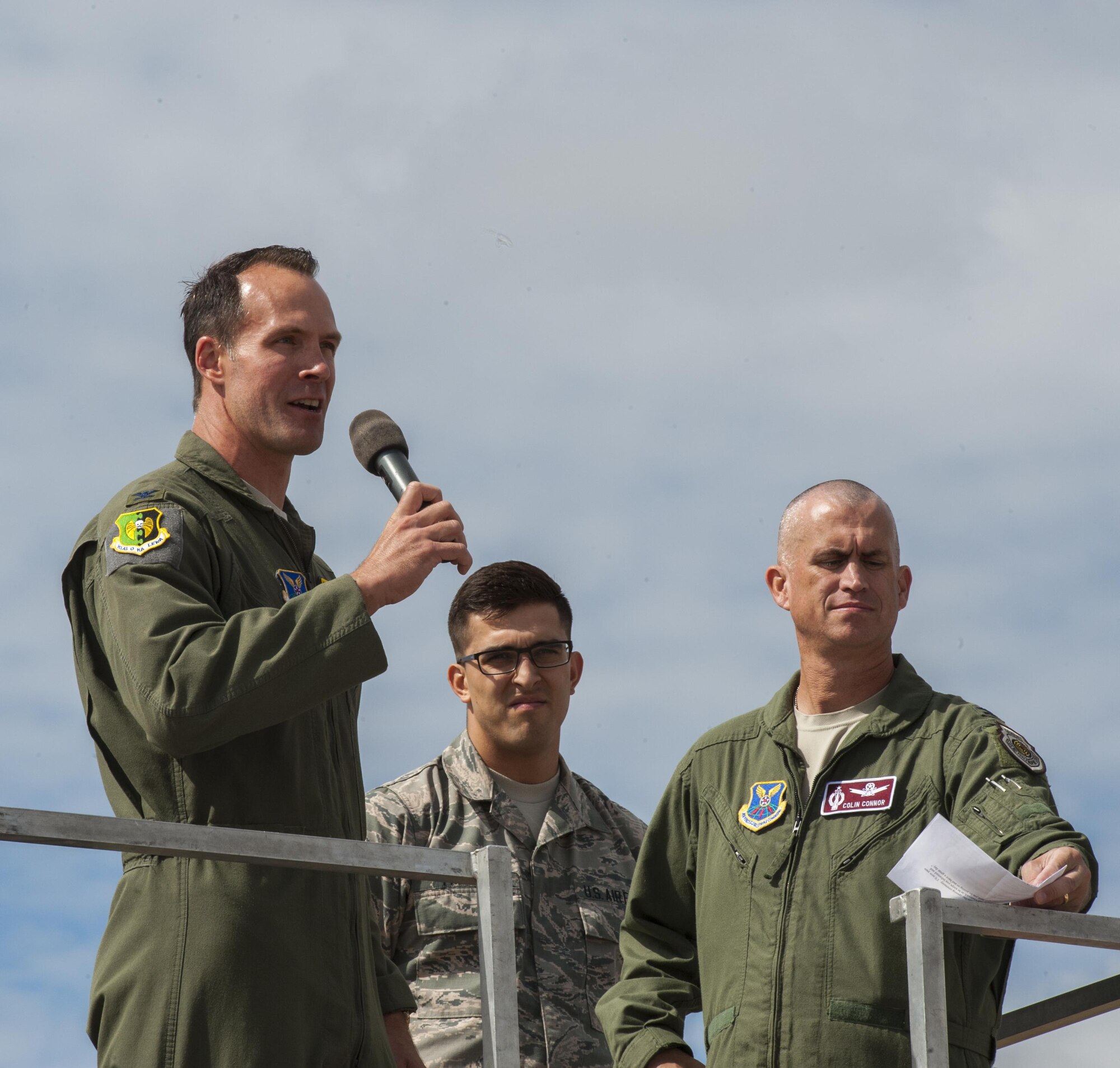Spectators watch an F-16 Fighting Falcon demo during the Northern Neighbors Day Air Show at Minot Air Force Base, N.D., Aug. 13, 2016. NND included several aerial acts including the F-16, bi-plane crop dusters and old World War II planes. (U.S. Air Force photo/Airman 1st Class Christian Sullivan)