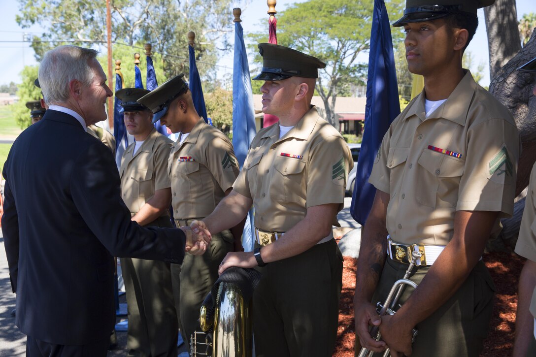 CAMP PENDELTON, Calif. -- Ray Mabus, the Secretary of the Navy, shakes hands with Marines at the ship naming ceremony for the new Arleigh Burke Class Destroyer, the USS Basilone (DDG-122), at the 1st Marine Division Headquarters, Aug. 16, 2016. The USS Basilone is scheduled to be commissioned in 2022. (Marine Corps Photo by Lance Cpl. Emmanuel Necoechea)