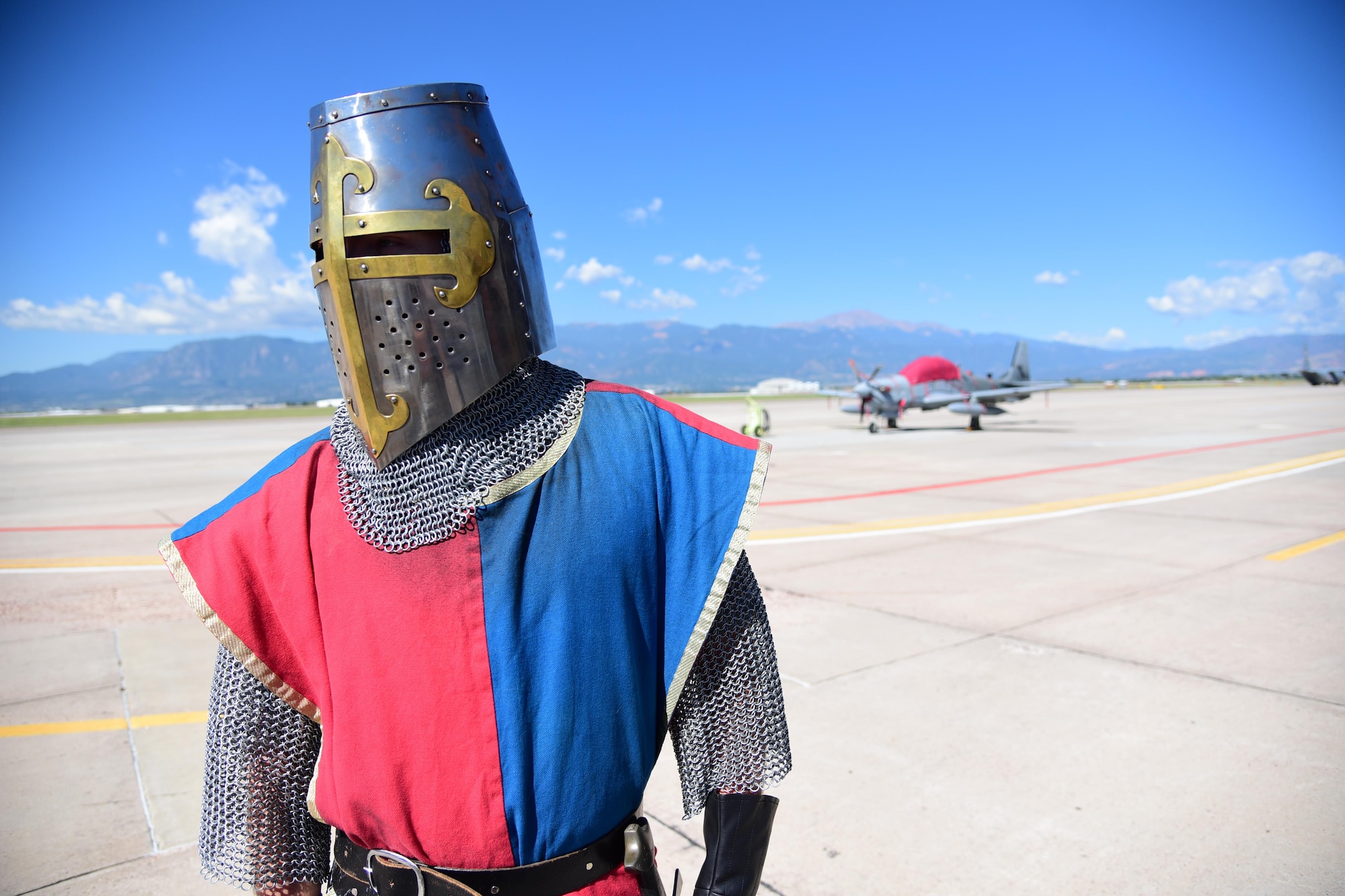An iron clad knight stands on the flightline of Peterson Air Force Base, Colo., Aug. 12, 2016. Staff Sgt. Gary Christensen, 21st Logistics Readiness Squadron NCO in charge of deployment operations, spent about seven years collecting an array of armor pieces to complete his look as a knight. (U.S. Air Force photo by Staff Sgt. Amber Grimm)
