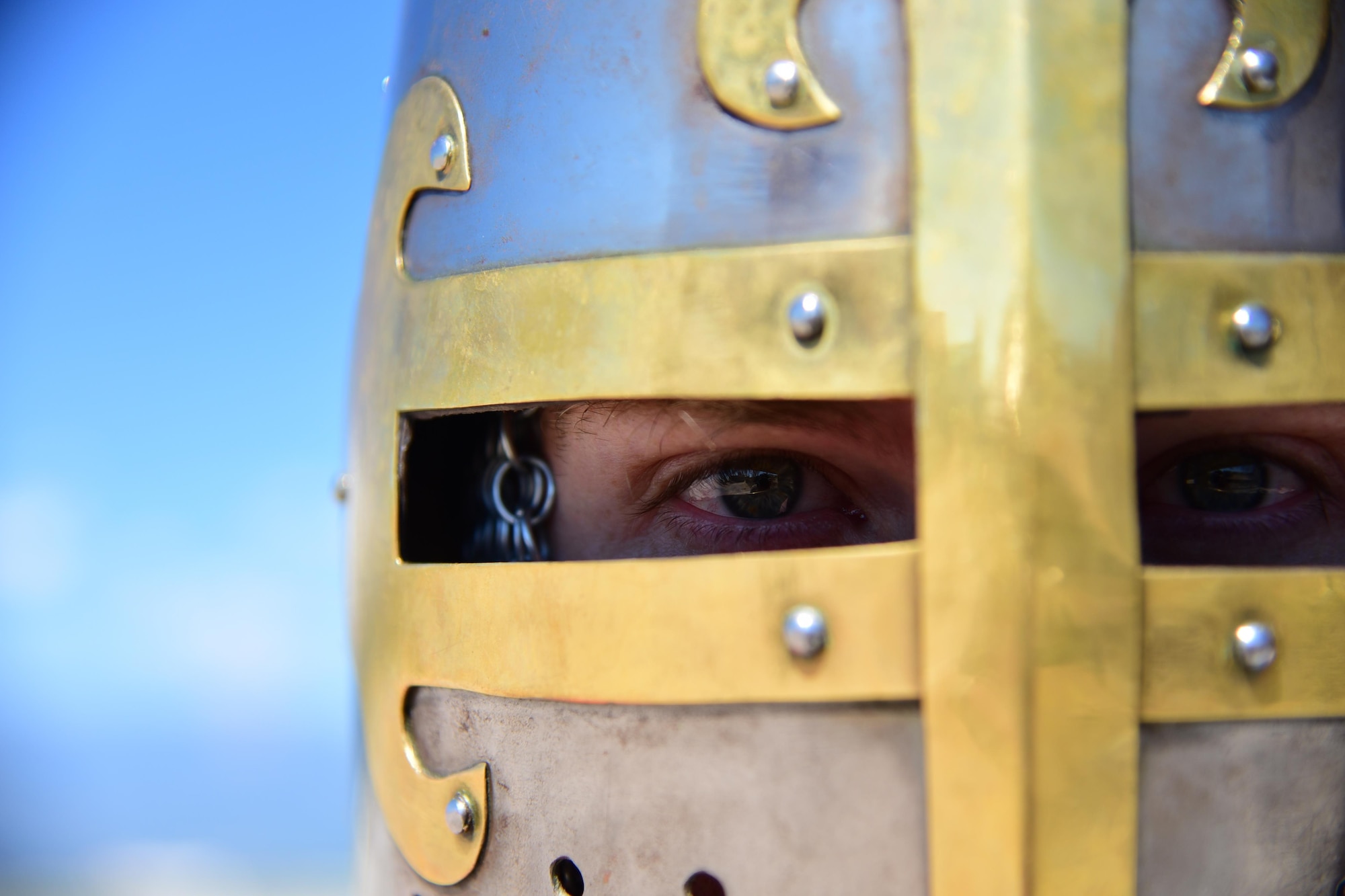 Staff Sgt. Gary Christensen, 21st Logistics Readiness Squadron NCO in charge of deployment operations, peers out from behind a steel helm at Peterson Air Force Base, Colo., Aug. 12, 2016. A medieval enthusiast for most of his life, Christensen spent seven years collecting pieces to complete his armored knight ensemble. (U.S. Air Force photo by Staff Sgt. Amber Grimm)