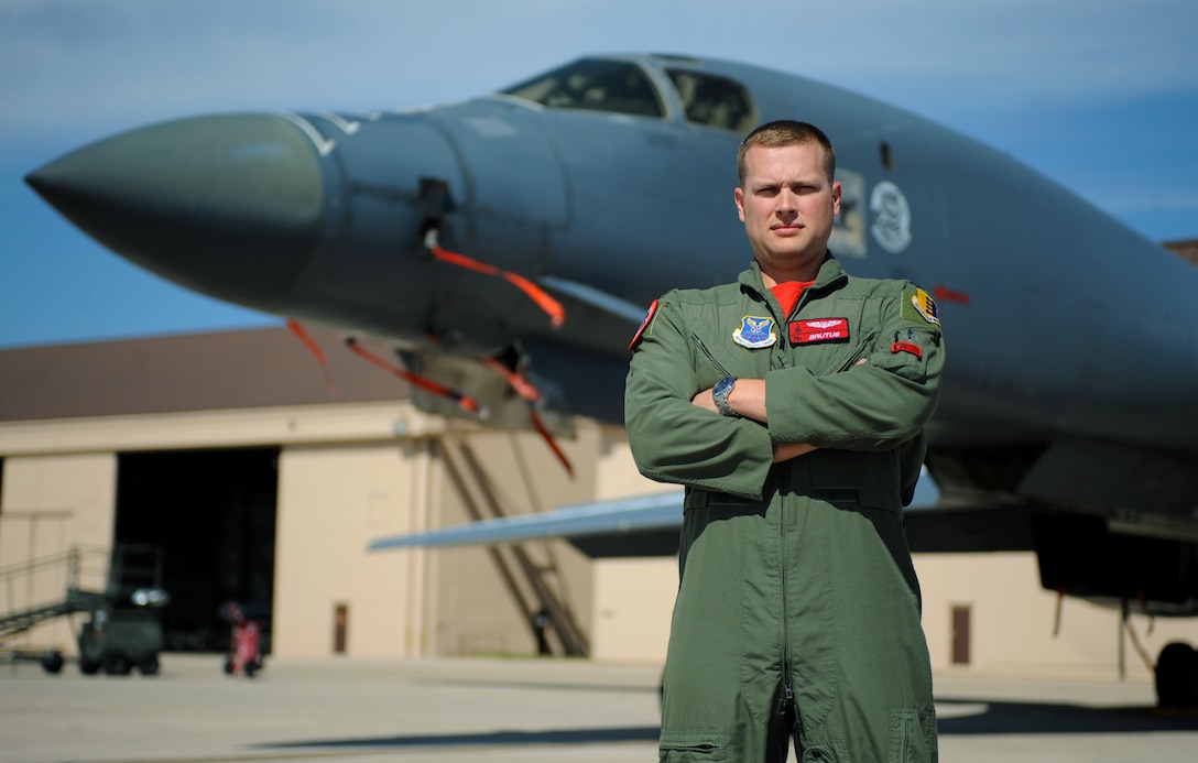 Captain Aaron Tindall, a weapons system officer assigned to the 34th Bomb Squadron, poses in front of a B-1 bomber at Ellsworth Air Force Base, S.D., August 5, 2016. Tindall was the only officer from Ellsworth selected to participate in a joint training program with the U.S. Navy EA-18G Growlers, focusing on electronic warfare. (U.S. Air Force photo by Airman 1st Class Denise M. Jenson)