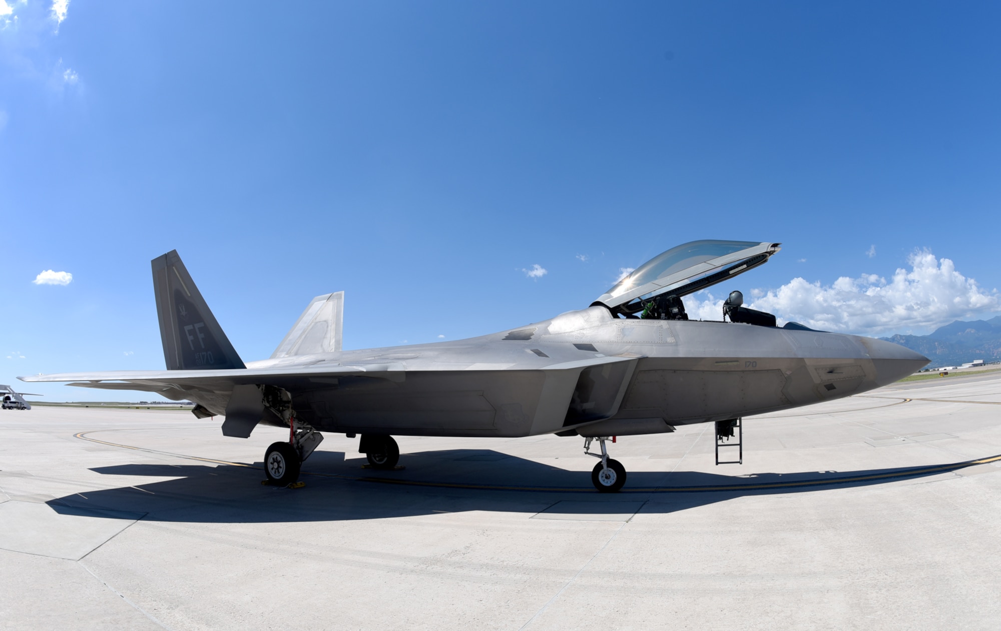 An F-22A Raptor assigned to the 94th Fighter Squadron at Langley Air Force Base, Va., waits to be refueled on the flightline at Peterson Air Force Base, Colo., Aug. 12, 2016. The aircraft was coming from Edwards AFB, Calif., where it underwent various tests and is now headed back to Langley AFB. (U.S. Air Force photo by Airman 1st Class Dennis Hoffman)
