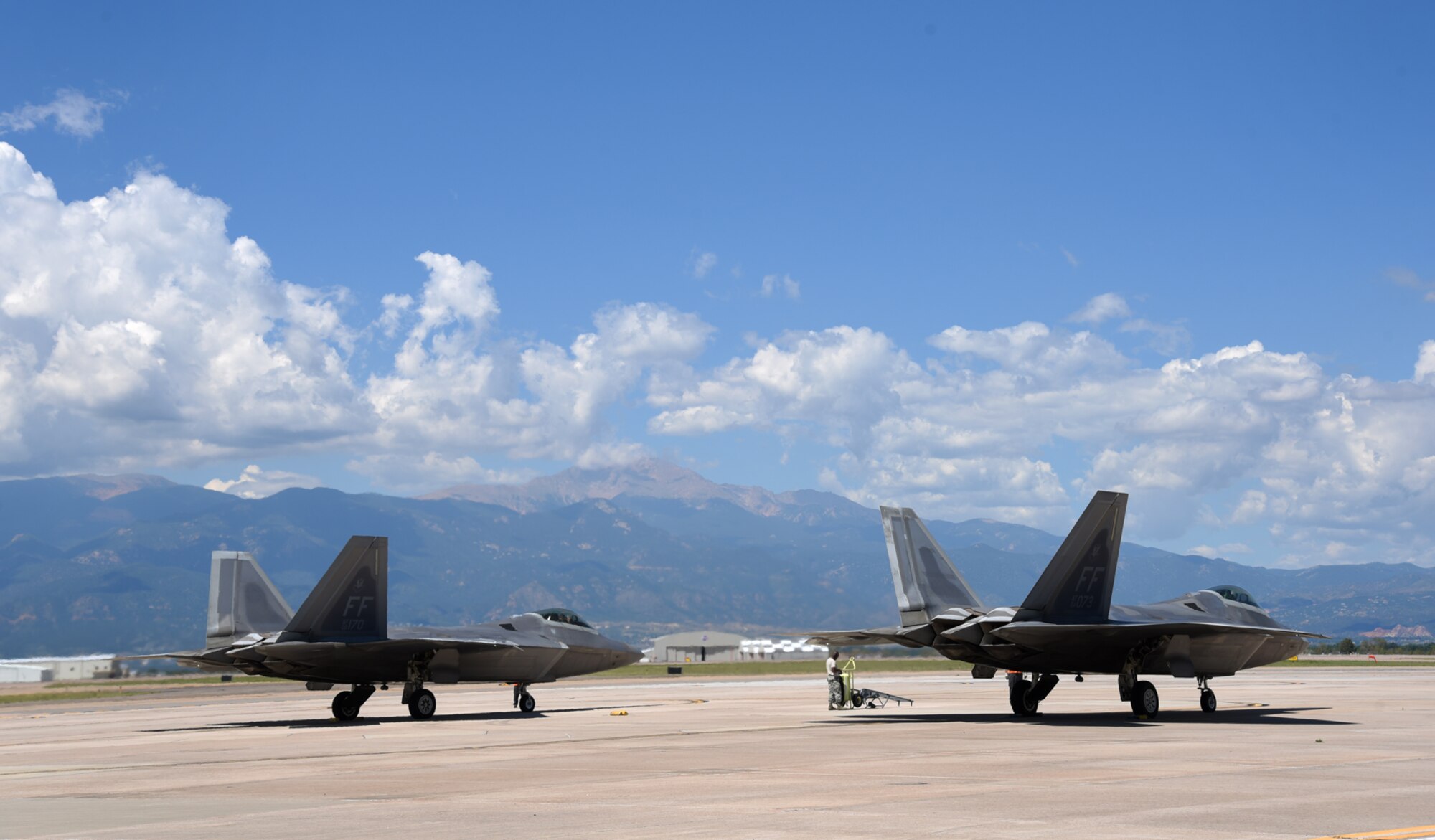 Two F-22A Raptors assigned to the 94th Fighter Squadron and the 27th Fighter Squadron at Langley Air Force Base, Va., prepare to leave Peterson Air Force Base, Colo., Aug. 12, 2016. The aircraft left Edwards AFB, Calif., and Nellis AFB, Nev., and are now ready to fly home to Langley AFB. (U.S. Air Force photo by Airman 1st Class Dennis Hoffman)