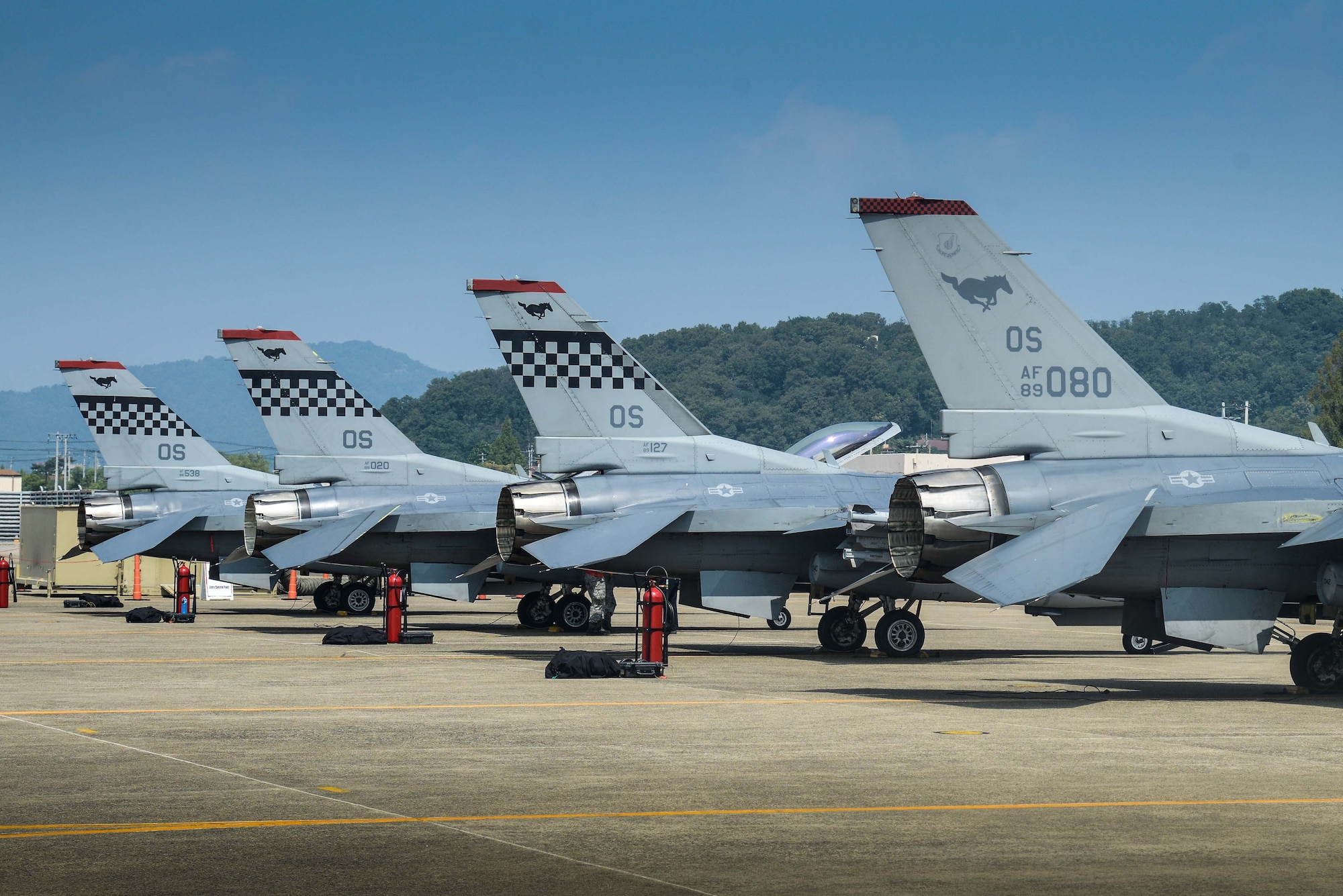 F-16 Fighting Falcons from the 36th Fighter Squadron rest on the flightline for preflight inspections during Buddy Wing 16-7 at Daegu Air Base, Republic of Korea, Aug. 12, 2016. The Buddy Wing program is a 7th Air Force initiative to foster and maintain close ties and interoperability between the U.S. ROK air forces by training and flying combined missions. (U.S. Air Force photo by Senior Airman Dillian Bamman)